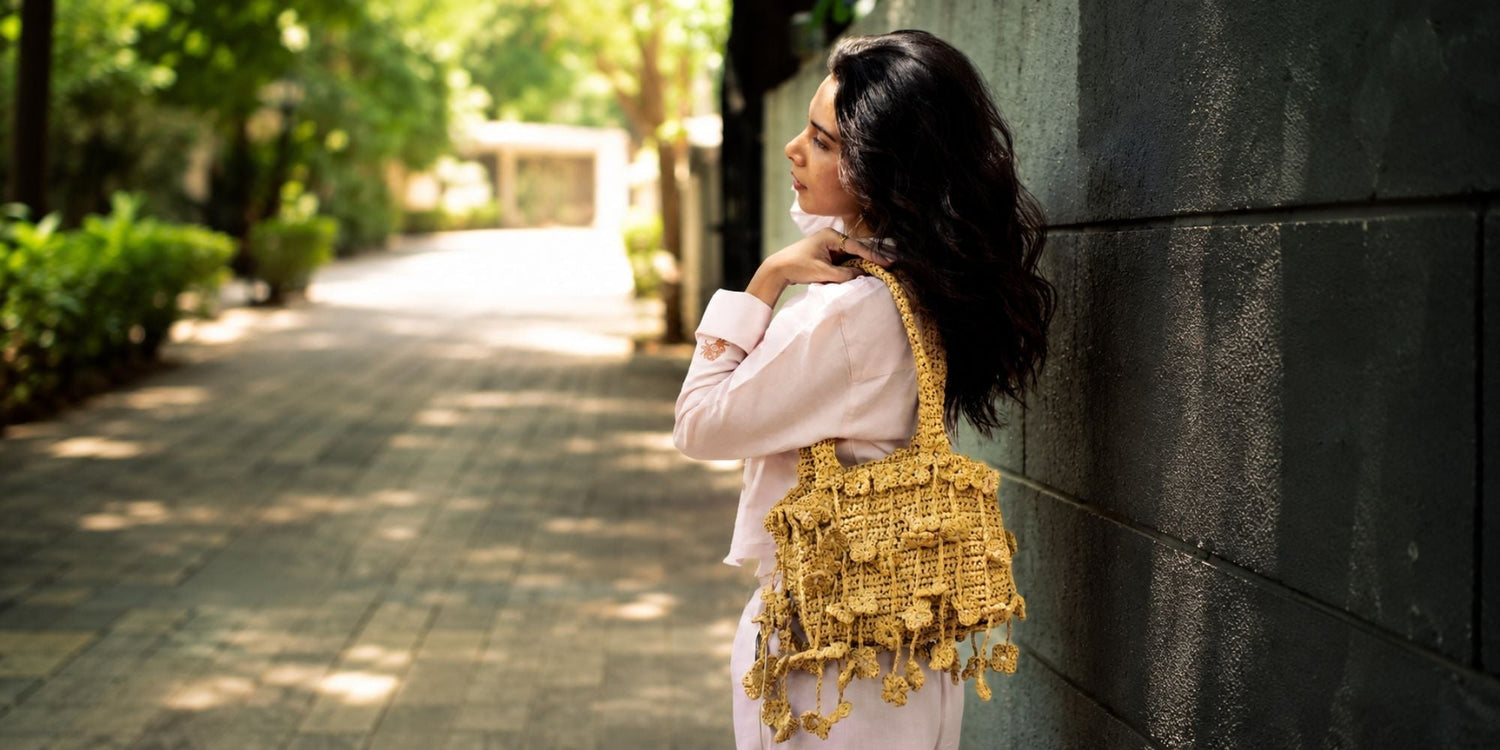 "Handcrafted raffia shoulder bag outdoor.