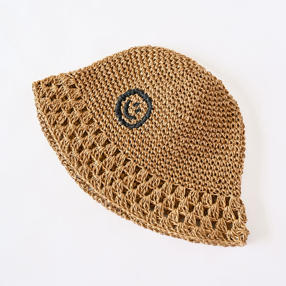 Raffia Bucket Hat in Coal black, side profile showing curved silhouette